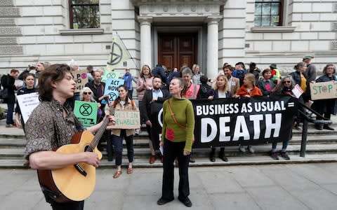 Climate protesters have targeted HM Treasury in Westminster  - Credit: Peter Nicholls/Reuters