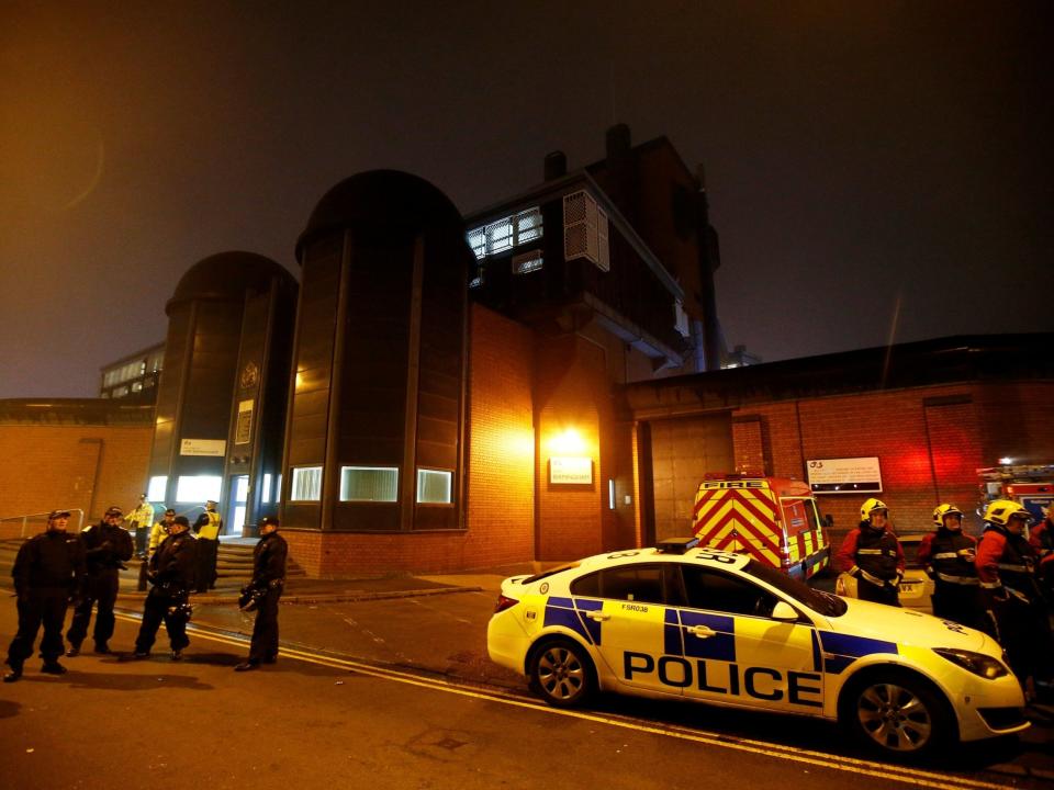 Police officers and firemen stand outside Winson Green prison, run by security firm G4S, after a serious disturbance broke out on 16 December 2016: Peter Nicholls/Reuters