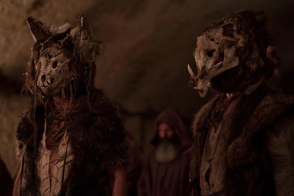 A pair of masked cave-dwellers appear for a ceremony in "Wrong Turn"