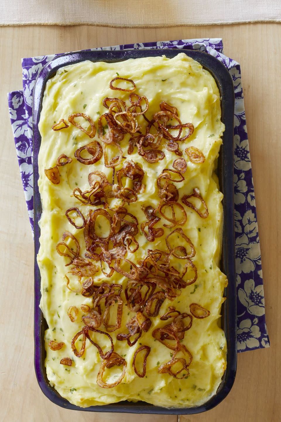 baked mashed potatoes with crispy shallots in casserole