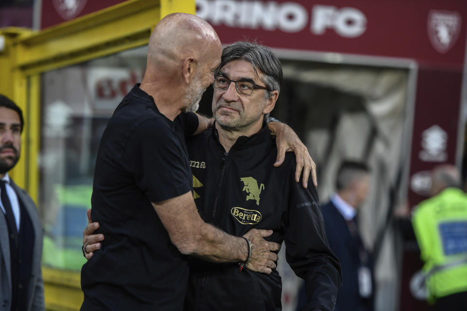 AC Milan's manager Stefano Pioli, left, congratulates Torino head coach Ivan Juric following a Serie A soccer match between Torino and AC Milan, Saturday, May 18, 2024, at the Olimpico Grande Torino Stadium in Turin, Italy. (Alberto Gandolfo/LaPresse via AP)