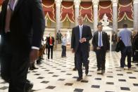 U.S. House Speaker John Boehner (R-OH) (C) walks to the House floor for procedural votes for legislation to fund the Department of Homeland Security at the Capitol in Washington, February 27, 2015. Congressional Republicans on Friday hoped to avoid a partial shutdown of the U.S. domestic security agency by finding votes to pass a three-week-long stopgap funding bill, which the White House said President Barack Obama would sign if it came to his desk. REUTERS/Jonathan Ernst (UNITED STATES - Tags: POLITICS)