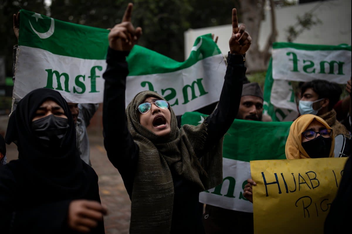 File An Indian Muslim woman shouts slogans during a protest against barring Muslim girls wearing hijab from attending classes at some schools in the southern Indian state of Karnataka  (AP)