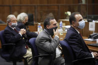 Attorney's for Robert Durst, David Chesnoff, left, and Dick Deguerin, with black mask, sit with prosecuting attorney's, Deputy District Attorney John Lewin and Habib A. Balian, right, listen as Los Angeles Superior Court Judge Mark E. Windham reads the verdict Friday, Sept. 17, 2021 in Inglewood, Calif. A Los Angeles jury convicted Robert Durst on Friday of murdering his best friend 20 years ago, a case that took on new life after the New York real estate heir participated in a documentary that connected him to the slaying that was linked to his wife’s 1982 disappearance. (Genaro Molina/Los Angeles Times via AP, Pool)