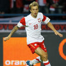 Nom: Kamil Grosicki<br>Poste: Milieu de terrain<br>Date de naissance (Âge): 08/06/1988 (24)<br>Numéro: 21<br>Club:Sivasspor<br>Taille: 177cm<br>Poids: 75kg