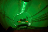 A modified Tesla Model X drives in the tunnel entrance before an unveiling event for the Boring Co. Hawthorne test tunnel in Hawthorne, California, U.S., December 18, 2018. Robyn Beck/Pool via REUTERS