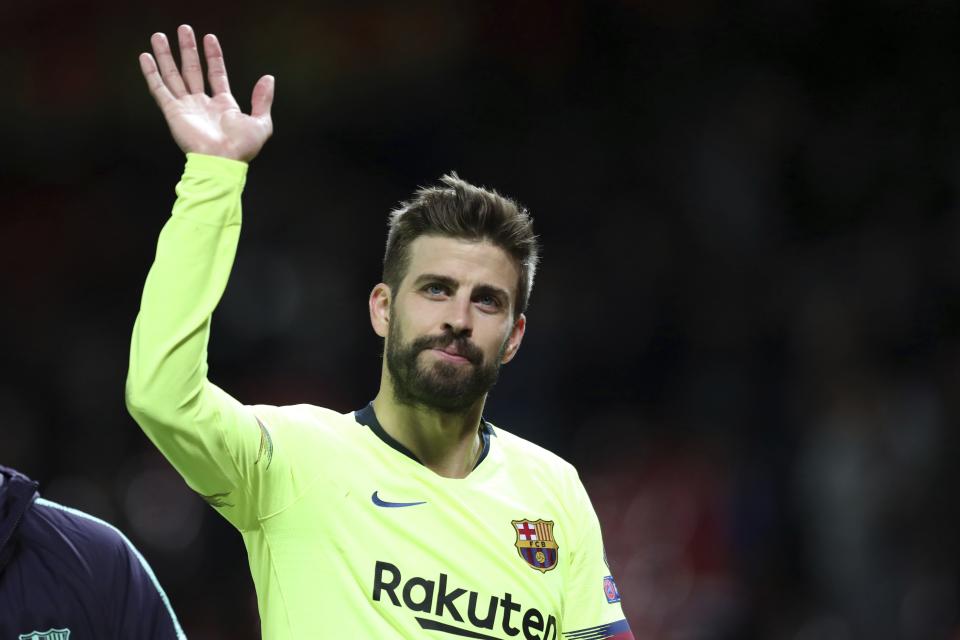 Barcelona's Gerard Pique waves to the fans after the Champions League quarterfinal, first leg, soccer match between Manchester United and FC Barcelona at Old Trafford stadium in Manchester, England, Wednesday, April 10, 2019. Barcelona won 1-0. (AP Photo/Jon Super)