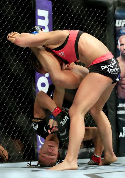 Felice Herrig and Paige VanZant grapple during their women&#39;s strawweight bout. (Getty)