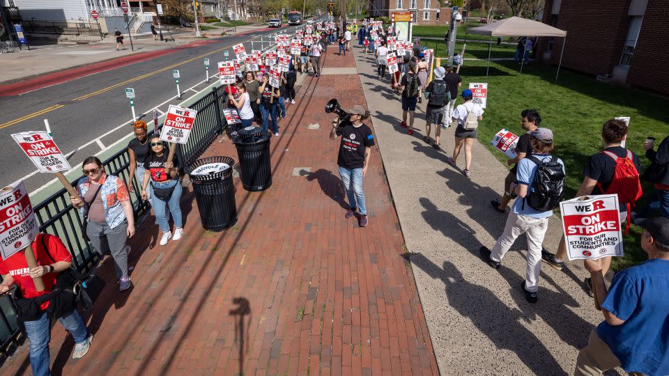 A protester with a bullhorn leads Rutgers students and faculty as they participate in a strike at the university's main campus in New Brunswick, New Jersey, in April 2023. - Michael Nigro/Pacific Press/LightRocket/Getty Images