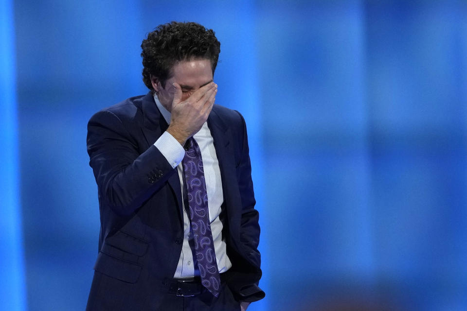 Pastor Joel Osteen wipes away tears as he talks about last week's shooting at Lakewood Church, Sunday, Feb. 18, 2024, in Houston. Osteen welcomed worshippers back to Lakewood Church for the first time since a woman with an AR-style opened fire in between services at his Texas megachurch last Sunday. (AP Photo/David J. Phillip)