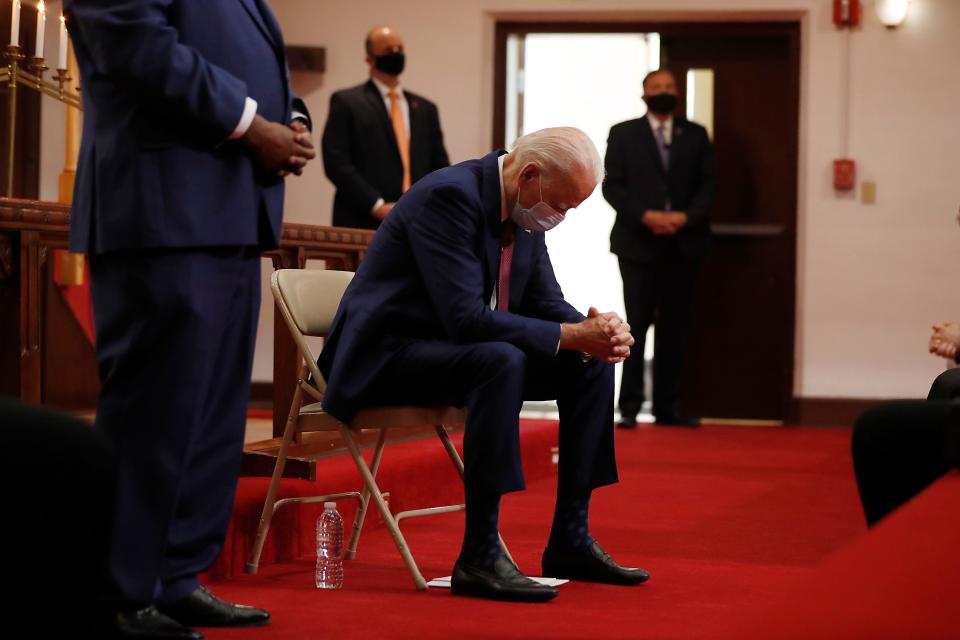 Democratic presidential candidate, former Vice President Joe Biden bows his head in prayer as he visits Bethel AME Church in Wilmington, Del., Monday, June 1, 2020. (AP Photo/Andrew Harnik)