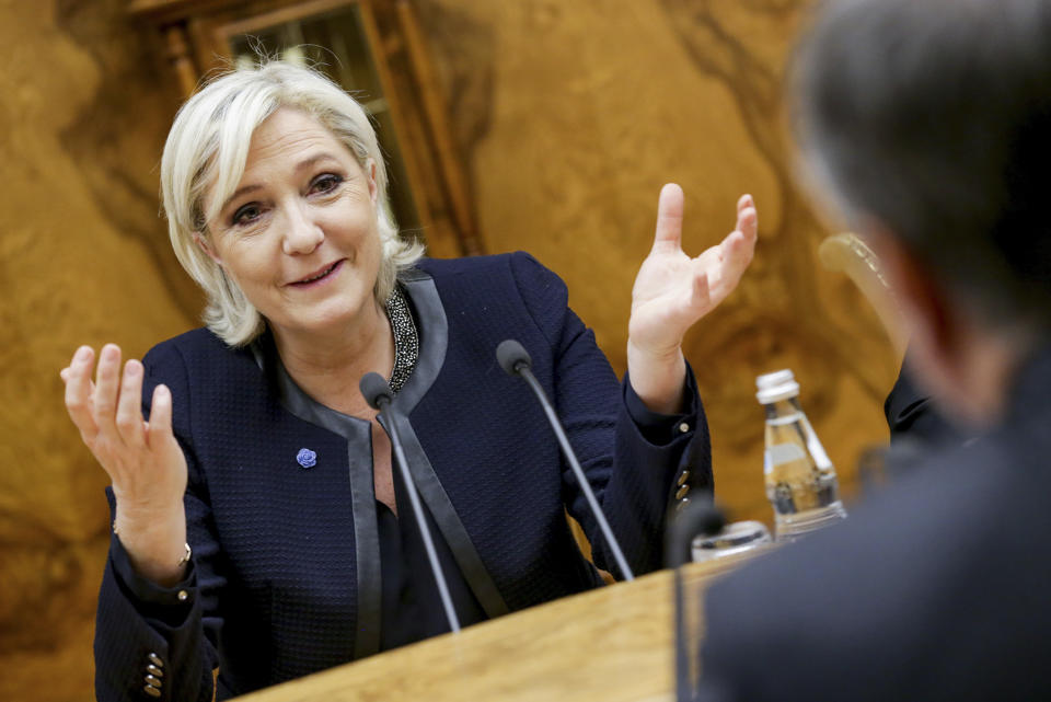 French far-right presidential candidate Marine Le Pen, left, gestures as she speaks to Vyacheslav Volodin, back to a camera, during their meeting in the Lower House of the Russian Parliament in Moscow, Russia, Friday, March 24, 2017. Le Pen has made multiple visits to Russia, as have her father, niece and other members of the National Front, often meeting with Russian legislators. (Anna Isakova /Photo service of the State Duma Pool Photo via AP)