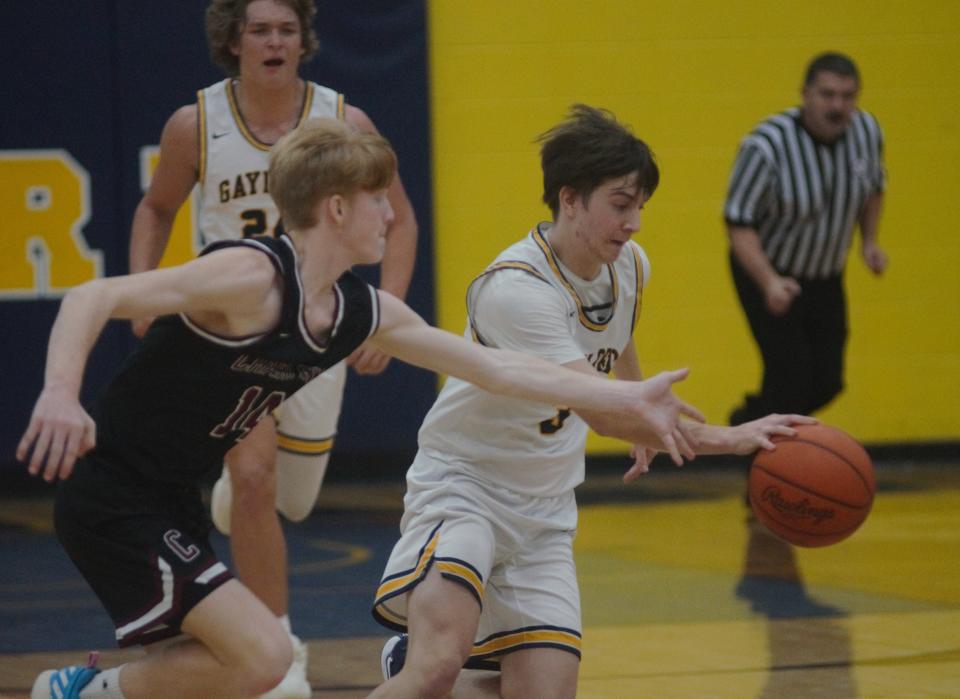 Aidan Locker pushes the ball up the floor during a basketball matchup between Gaylord and Charlevoix on Tuesday, December 6 in Gaylord, Mich.