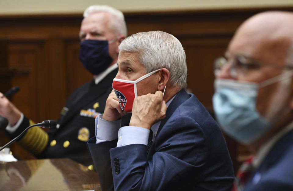 Dr. Anthony Fauci, director of the National Institute for Allergy and Infectious Diseases, center, Dr. Robert Redfield, director of the Centers for Disease Control and Prevention (CDC), right, and Adm. Brett Giroir, Assistant Secretary of Health and Human Services for Health, left, testify during a House Subcommittee hearing on the Coronavirus crisis, Friday, July 31, 2020 on Capitol Hill in Washington. (Kevin Dietsch/Pool via AP)