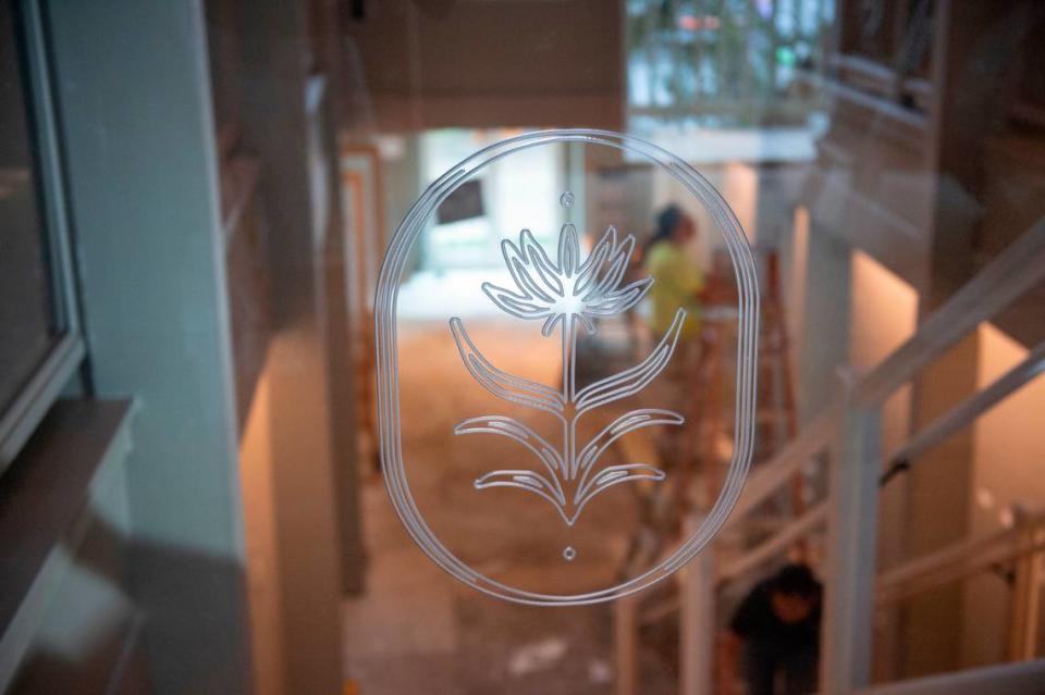 The logo of The Springs Hotel is displayed on the banister inside the boutique hotel as it is under construction in Ocean Springs.