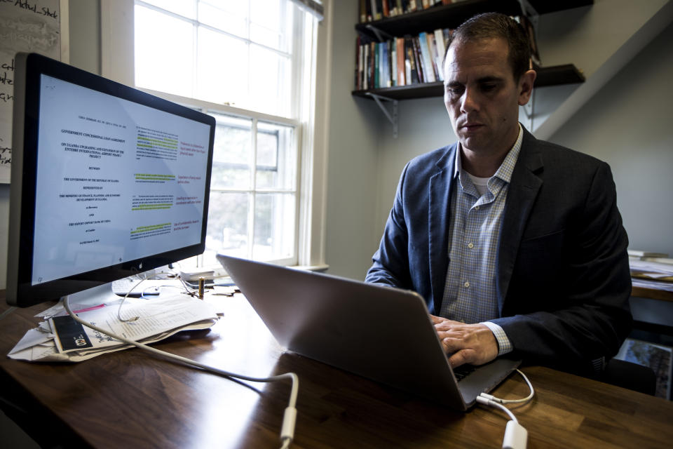 Brad Parks, executive director of the research lab AidData, works on a computer in his office at William and Mary in Williamsburg, Va., on Tuesday, May 16, 2023. “You’ve got a growing number of countries that are in dire financial straits,” says Parks, attributing it largely to China’s stunning rise in just a generation from being a net recipient of foreign aid to the world’s largest creditor. (AP Photo/John C. Clark)