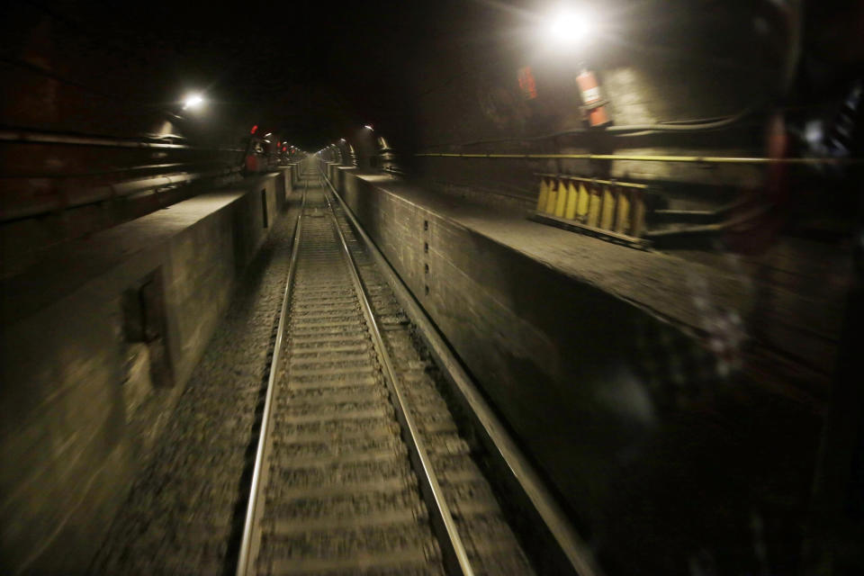 FILE - This Aug. 17, 2015 file photo shows a train tunnel under the Hudson River in North Bergen, N.J., as seen from the back of an Amtrak train bound for New York's Penn Station. Myriad problems in the Hudson River rail tunnel must be addressed in the next few years to avoid potentially catastrophic failures before a new tunnel is finally built, a soon-to-be-completed study by Amtrak spells out in stark detail. (AP Photo/Mel Evans, File)