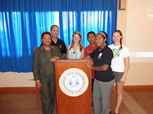 The Author (center) standing with instructors David Ginsburg and Kristen Weiss and rangers Princess, Harlan, and Mister at the Koror State Capital building.