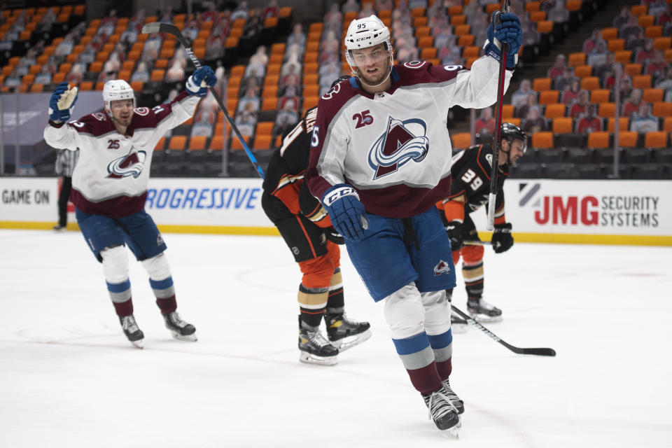 Colorado Avalanche left wing Andre Burakovsky, right, celebrates his goal in the first period of an NHL hockey game against the Anaheim Ducks in Anaheim, Calif., Sunday, April 11, 2021. (AP Photo/Kyusung Gong)