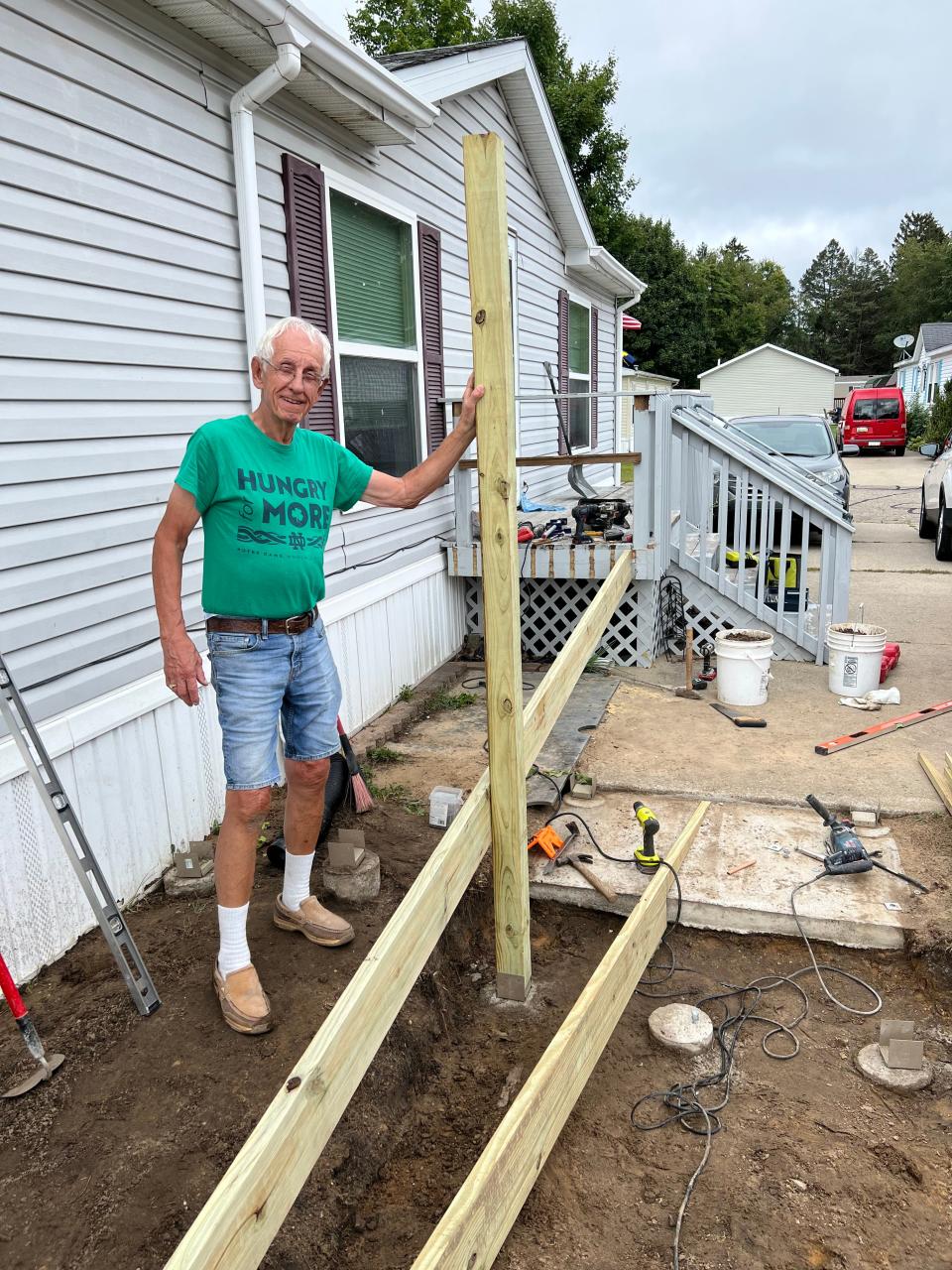 Bob Kistler of Helping Hands begins work on building a ramp at the home of a Clay United Methodist Church member.