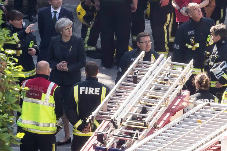 Prime Minister Theresa May speaks to Dany Cotton, Commissioner of the London Fire Brigade. (Photo: Dan Kitwood/Getty Images)