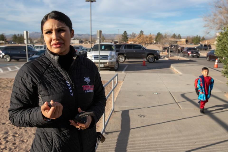 Cassandra Soto, secretary of Tornillo ISD’s PreK-8th campus, is outside the building to greet arriving students, Monday, Feb. 26. (Corrie Boudreaux/El Paso Matters)