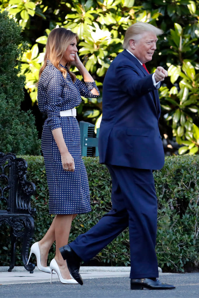 Melania Trump wears white Christian Louboutin pumps at the Congressional Picnic alongside the president. - Credit: Shutterstock