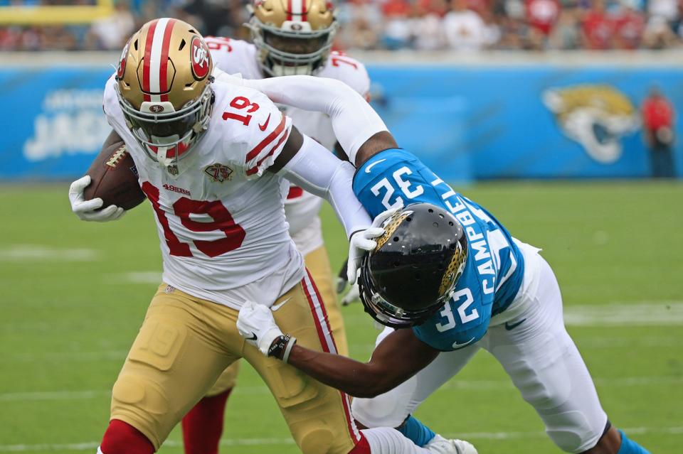 Jacksonville Jaguars cornerback Tyson Campbell (32) manages to shove San Francisco 49ers wide receiver Deebo Samuel (19) out of bounds during the first quarter at TIAA Bank Field Sunday, Nov. 21, 2021 in Jacksonville. The Jacksonville Jaguars hosted the San Francisco 49ers during a regular season NFL game. [Corey Perrine/Florida Times-Union]