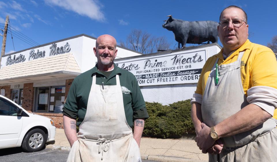 Andy Sabatos Jr. and John Sabatos Jr. outside their store in Middletown. Sabatos Prime Meats closed its doors in March after more than 100 years in business.