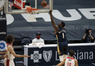 New Orleans Pelicans forward Zion Williamson (1) shoots over Washington Wizards guard Raul Neto (19) in the first quarter of an NBA basketball game in New Orleans, Wednesday, Jan. 27, 2021. (AP Photo/Derick Hingle)