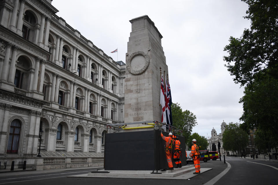 LONDON, ENGLAND - JUNE 11: Workers erect a protective barrier around the Cenotaph in anticipation of protests tomorrow on June 11, 2020 in London, England. Outside the Houses of Parliament, the statue of former Prime Minister Winston Churchill was spray-painted with the words "was a racist" amid anti-racism protests over the weekend. In Bristol, protesters toppled a statue of Edward Colston, a 17th-century slave-trader, and tossed it into the harbor. (Photo by Peter Summers/Getty Images)