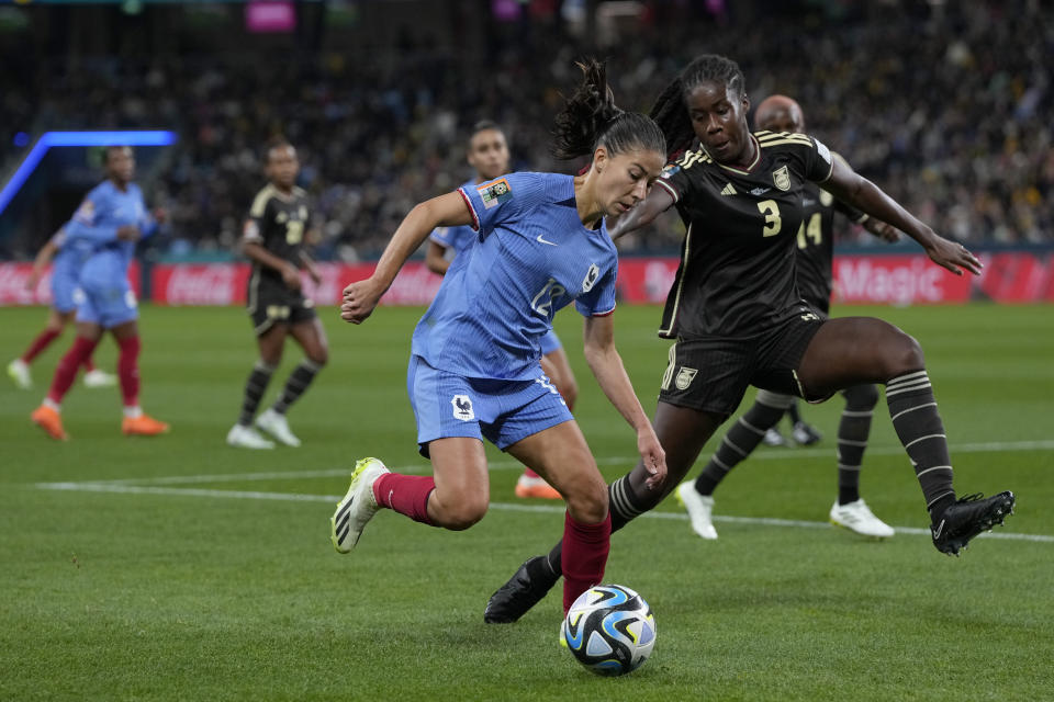 France's Clara Mateo is challenged by Jamaica's Vyan Sampson during the Women's World Cup Group F soccer match between France and Jamaica at the Sydney Football Stadium in Sydney, Australia, Sunday, July 23, 2023. (AP Photo/Mark Baker)