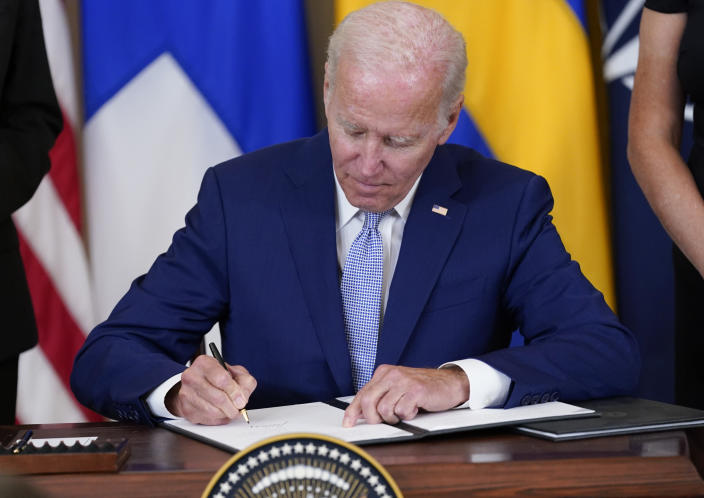 President Joe Biden signs the Instruments of Ratification for the Accession Protocols to the North Atlantic Treaty for the Kingdom of Sweden in the East Room of the White House in Washington, Tuesday, Aug. 9, 2022. The document is a treaty in support of Sweden joining NATO. (AP Photo/Susan Walsh)
