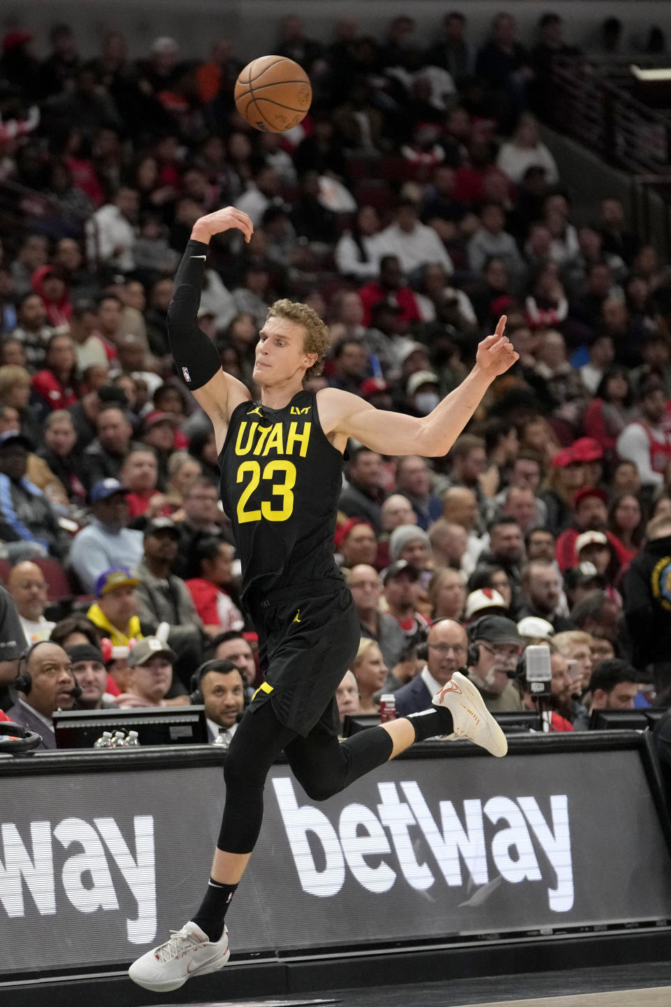 Utah Jazz's Lauri Markkanen saves a ball from going out of bounds during the first half of an NBA basketball game against the Chicago Bulls Monday, Nov. 6, 2023, in Chicago. (AP Photo/Charles Rex Arbogast)