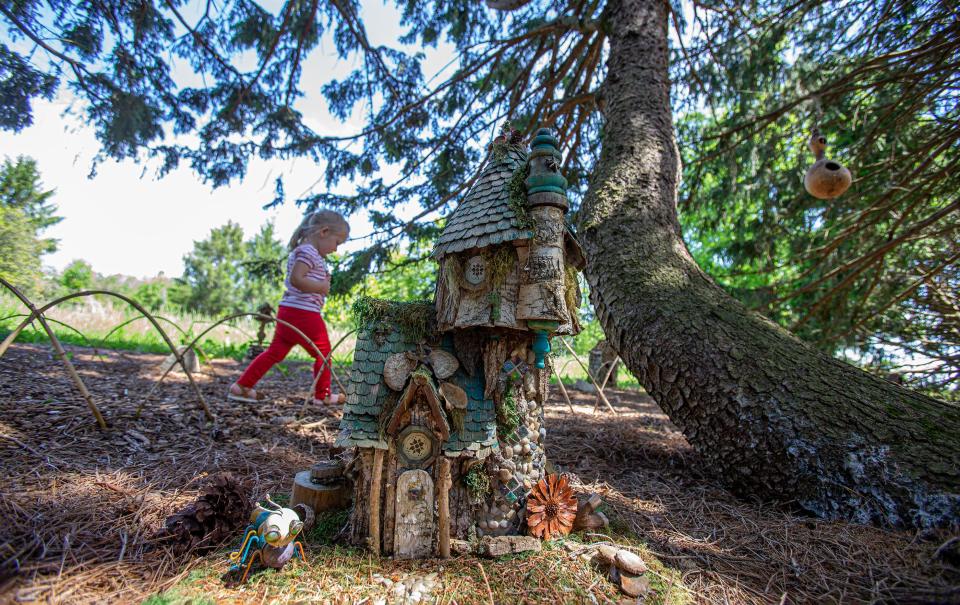 Two-year-old Emma walked around the path in the Fairy Forest at Yew Dell Botanical Gardens. May 11, 2023