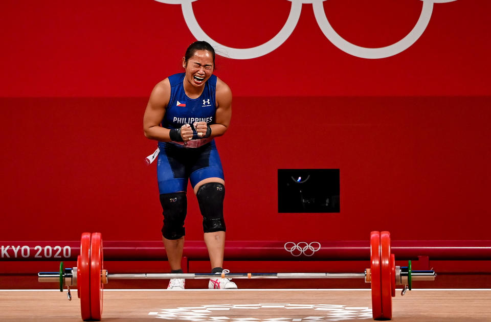 <p>Hidilyn Diaz becomes overwhelmed with emotion as she brings home the gold to the Philippines — the country's first gold medal — and sets a new Olympic record of lifting 127kg in the clean and jerk during the women's 55kg group A weightlifting final at the Tokyo International Forum on July 26.</p>