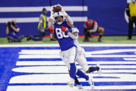Indianapolis Colts tight end Trey Burton (80) makes a catch in front of Tennessee Titans free safety Kevin Byard for a touchdown in the first half of an NFL football game in Indianapolis, Sunday, Nov. 29, 2020. (AP Photo/AJ Mast)