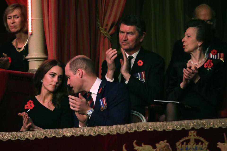 <p>Wiliam and Kate share a moment during the performances, while Princess Anne and Sir Timothy Laurence applaud behind them. </p>