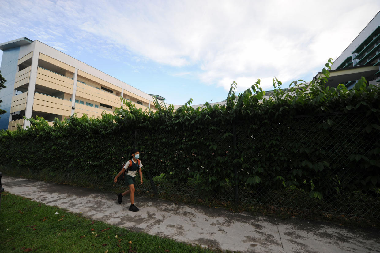 SINGAPORE, June 2, 2020  -- A primary school student wearing a face mask is seen on his way to school in Singapore on June 2, 2020. Schools in Singapore reopened on Tuesday as the state embarked on a phased reopening from a COVID-19 "circuit breaker" period to curb the spread of the coronavirus.(Photo by Then Chih Wey/Xinhua via Getty) (Xinhua/xinjiapo via Getty Images)