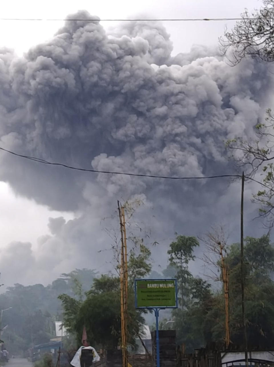 In this photo released by Indonesia's National Disaster Mitigation Agency (BNPB) Mount Semeru spews volcanic material during an eruption in Lumajang, East Java, Indonesia, Saturday, Jan. 16, 2021. The highest volcano on Indonesia's most densely populated island of Java, spewed hot clouds as far away as 4.5 kilometers (nearly 3 miles) on Saturday. (National Disaster Mitigation Agency via AP)