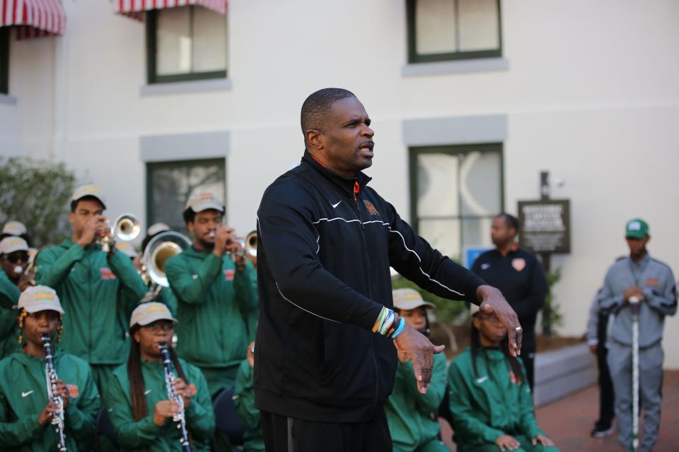 Florida A&M University's Marching 100 band director Shelby Chipman directs the crowd as they sang along with the band during FAMU Day at the Capitol, Feb. 21, 2024.