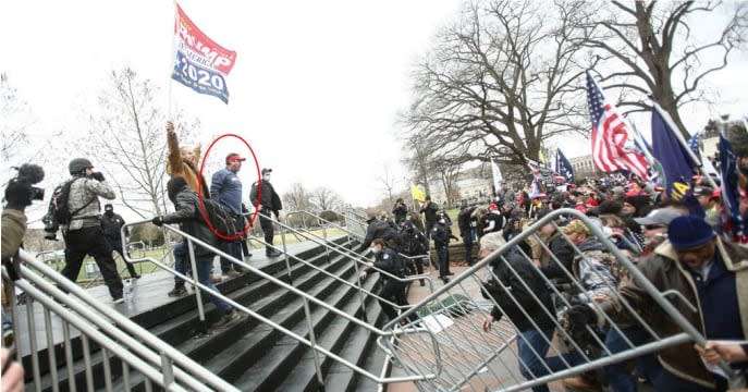 Photograph showing Schubert (circled in red) after breaching the police barrier at Peace Circle