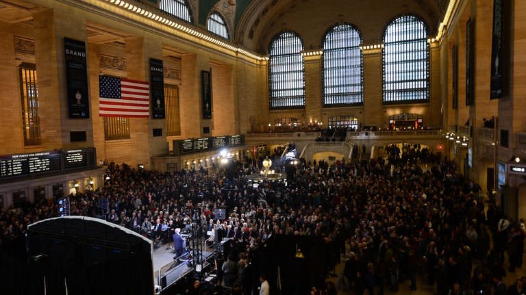 People attend Grand Central Terminal centennial celebrations in New York, February 1, 2013. Built in palatial Beaux Arts style, celebrated in movies, and narrowly saved from the wrecking ball in the 1970s, New York's Grand Central rail station turned 100 Friday