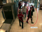 ADDS NAME OF SUSPECT ON RIGHT- In a frame from surveillance camera footage taken Oct. 2, 2018, and published Thursday, Oct. 18, 2018, by the pro-government Turkish newspaper Sabah, a man identified by Turkish officials as Maher Abdulaziz Mutreb, right, walks at Ataturk Airport in Istanbul. Writer Jamal Khashoggi disappeared at the Saudi consulate in Istanbul on the same day. Saudi Arabia, which initially called the allegations "baseless," has not responded to repeated requests for comment from The Associated Press over recent days, including on Thursday over Mutreb’s identification. (Sabah via AP)