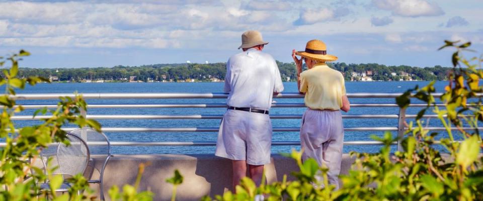 Senior couple enjoying time together by a lake