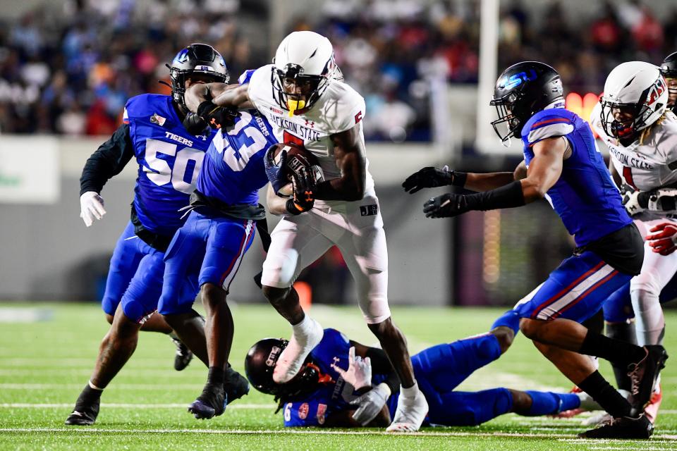 Jackson State’s Shane Hooks (5) is tackled by Tennessee State’s Boogie Trotter (23) while making a run during the Southern Heritage Classic between Jackson State and Tennessee State on Saturday, September 10, 2022, in Memphis, Tennessee. 