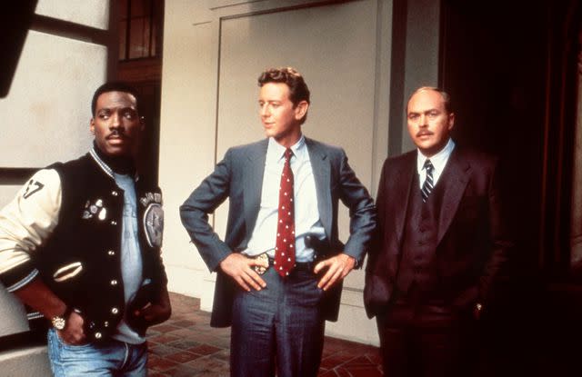 <p>everett collection</p> Eddie Murphy, Judge Reinhold and John Ashton in 'Beverly Hills Cop II'