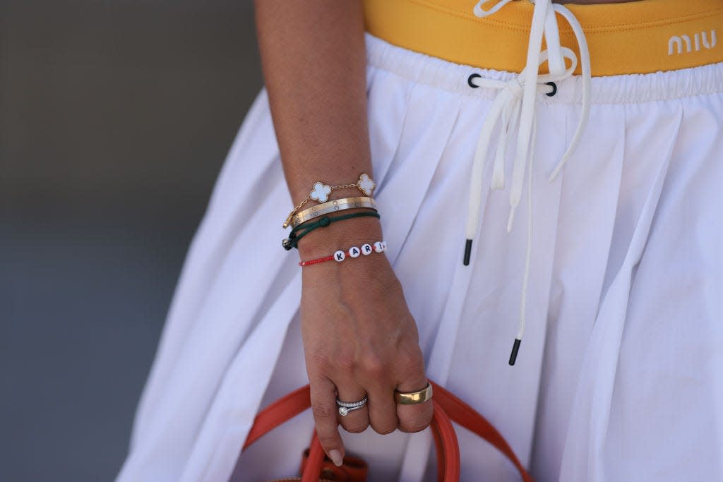 Van Cleef and Arpels Alhambra bracelet and Cartier Love bracelet on wrist