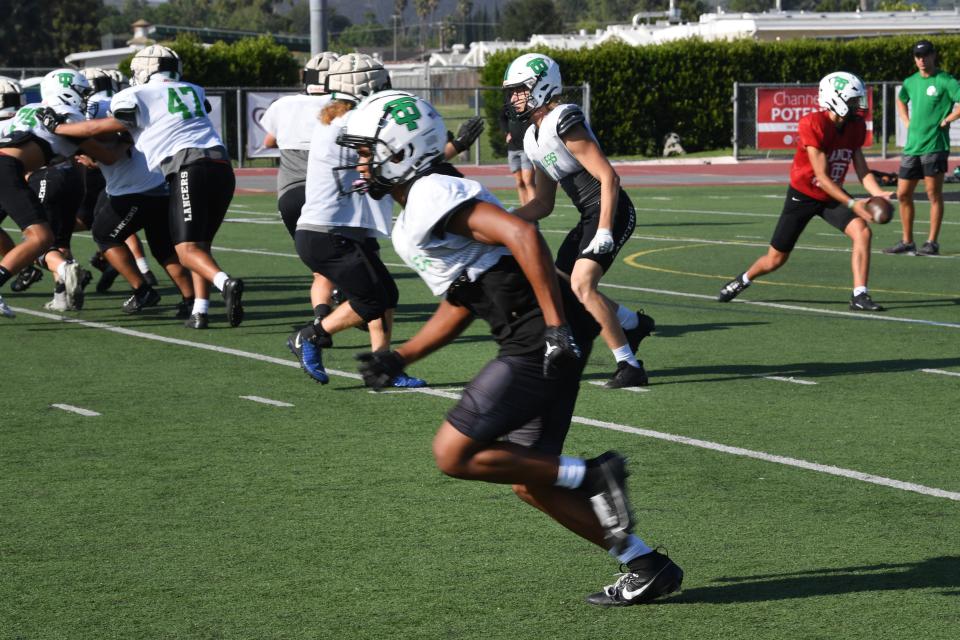 Receiver Silas Kemp runs a route during a Thousand Oaks High football practice on Tuesday, Sept. 19, 2023. Kemp has 18 receptions for 358 yards and five touchdowns. On defense, he has 23 solo tackles, two interceptions and one sack.