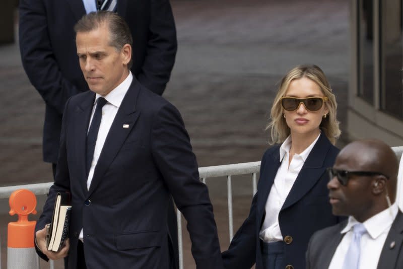 Hunter Biden, son of President Joe Biden, departs the J. Caleb Boggs Federal Building with his wife, Melissa Cohen Biden, on the fourth day of trial on criminal gun charges in Wilmington, Del., on Thursday. Photo by Ken Cedeno/UPI